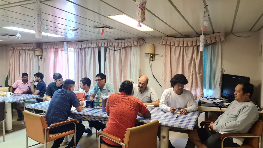 Crew members participating in the onboard design thinking workshop