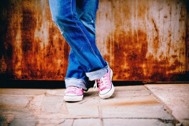 A young person’s feet up, relaxed, illustrating the stereotype of millennials as the article opens to challenge it